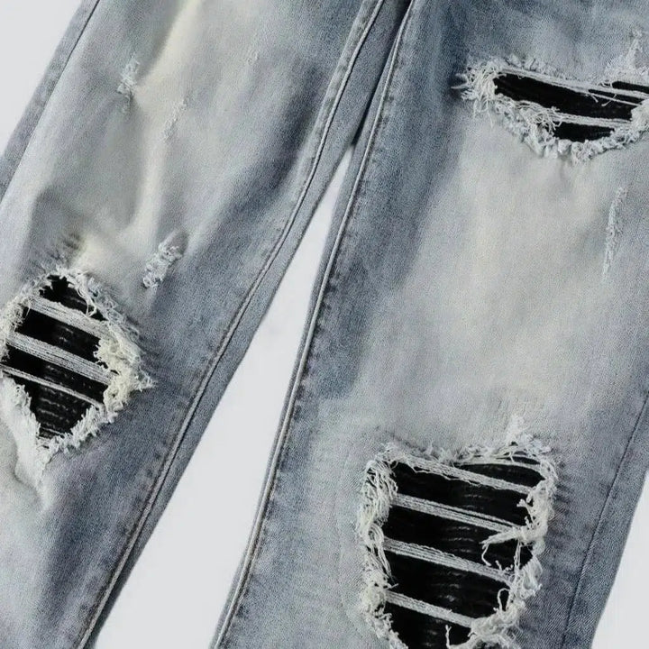 Black-patch whiskered jeans