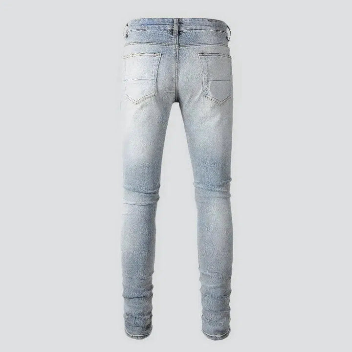 Black-patch whiskered jeans